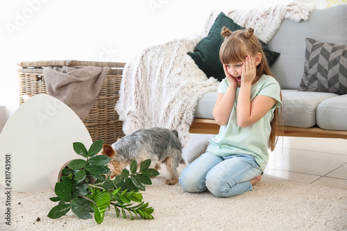 Cute little girl with dog a...