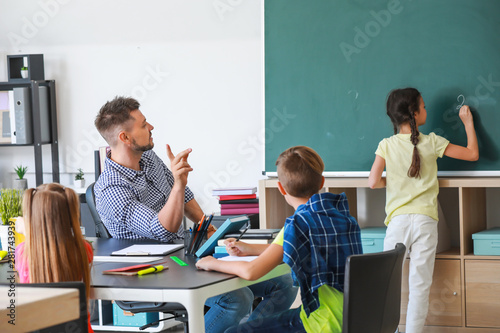 Cute children with teacher ...