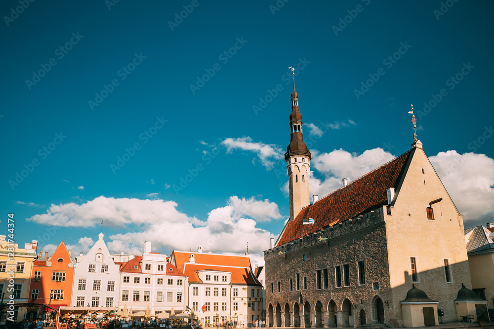 Fototapeta premium Tallinn, Estonia. Famous Old Traditional Town Hall Square In Sunny Summer Evening. Famous Landmark And Popular Place. Destination Scenic