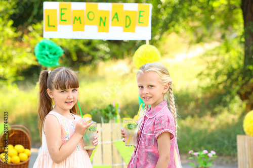 Cute little girls drinking ...
