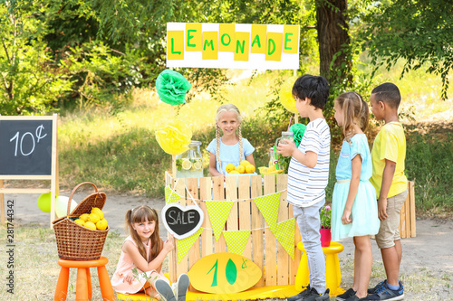 Cute little girl selling le...