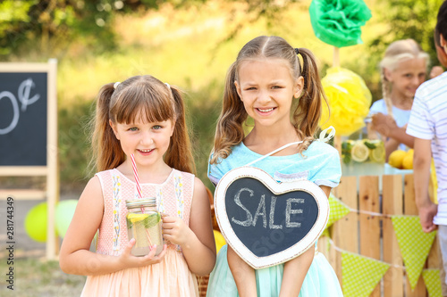 Cute little children sellin...