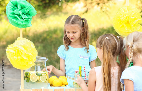 Cute little girl selling le...