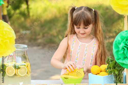 Cute little girl selling le...