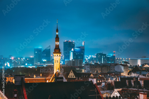 Tallinn, Estonia. Tower Of Town Hall On Background With Modern Urban Skyscrapers. City Centre Architecture