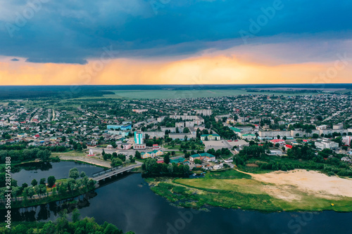 Dobrush, Gomel Region, Belarus. Aerial View Of Dobrush Cityscape Skyline In Spring Sunset Sunrise Time. Residential District And River In Bird's-eye View