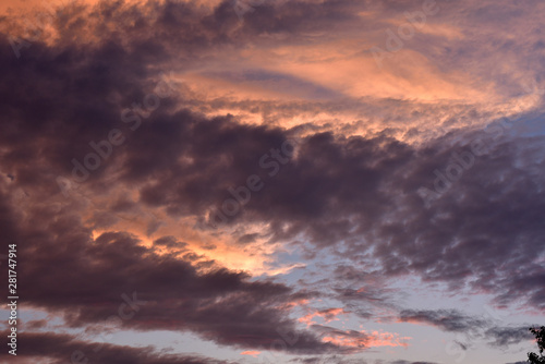 The clouds are lit by the setting sun.