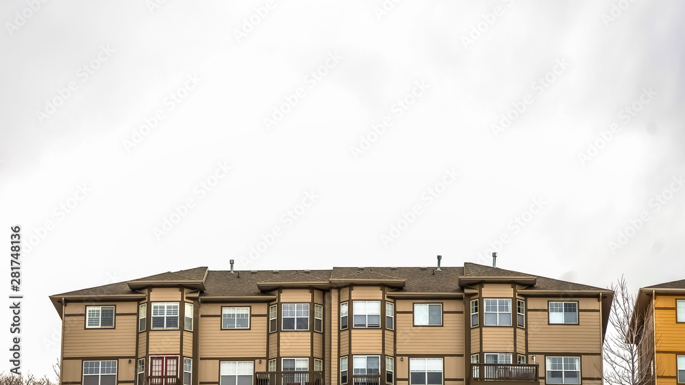 Panorama frame frame Overcast sky over homes with balconies and half hexagon shaped windows