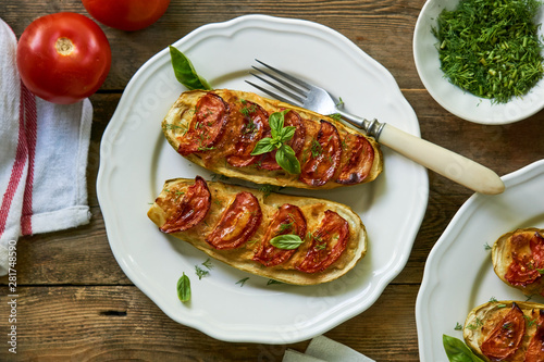 Stuffed zucchini with potatoes and tomatoes
