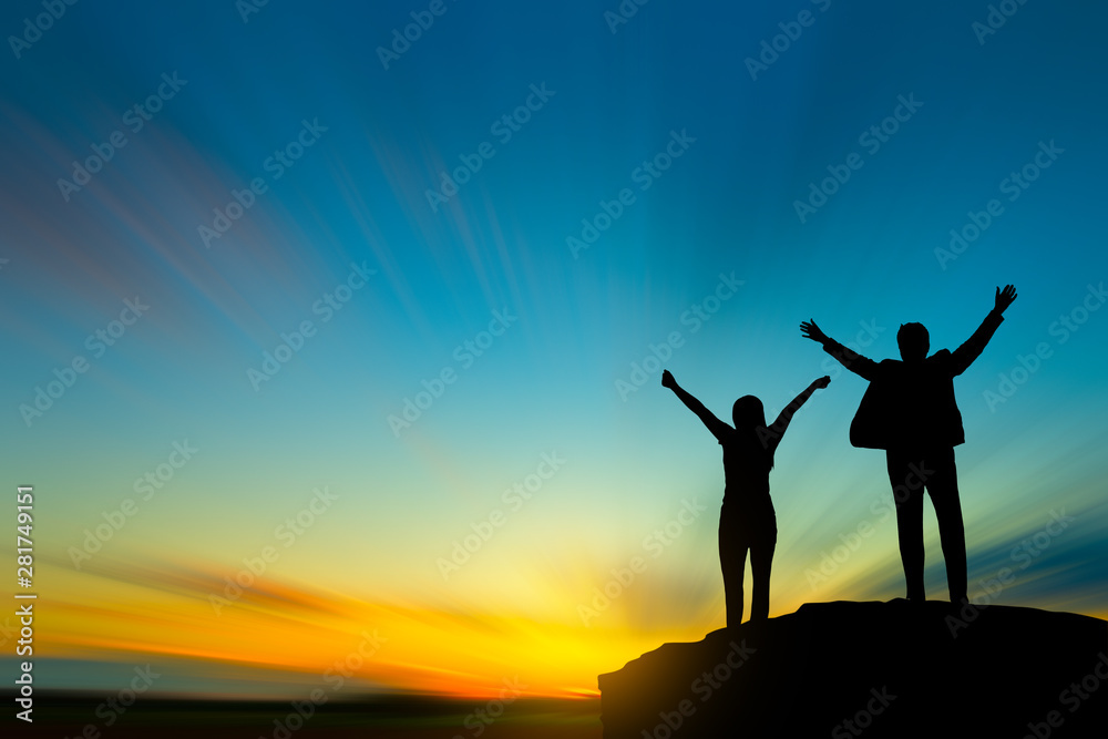 silhouette of people on mountain top over sky and sun light background,business, success, leadership, achievement and people concept silhouette of people on mountain top over sky and sun light background,business, success, leadership, achievement and people concept