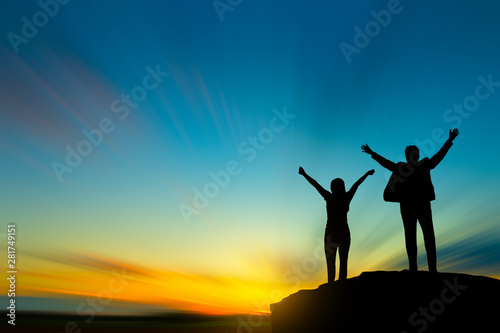 silhouette of people on mountain top over sky and sun light background,business, success, leadership, achievement and people concept