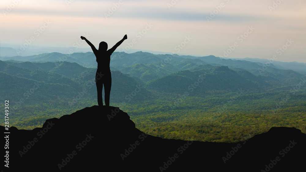 silhouette of woman on mountain top over sky and sun light background,business, success, leadership, achievement and people concept silhouette of woman on mountain top over sky and sun light background,business, success, leadership, achievement and people concept