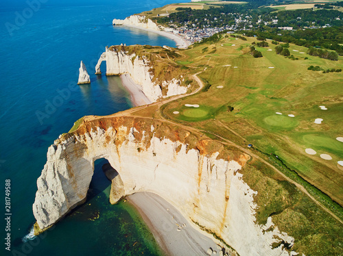 Picturesque landscape of white chalk cliffs and natural arches of Etretat, France