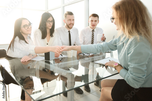 employers congratulate the employee on signing a new contrac photo