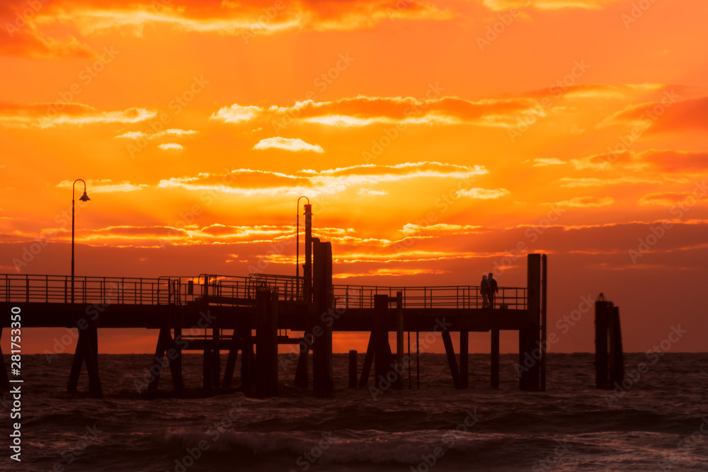 Silhouette of Glenelg Jetty at sunset. South Australia, Adelaide. Seaside landscape