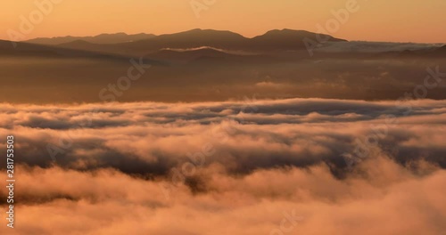 Mountains above fog at sunrise, Koshimizu, Hokkaido, Japan photo