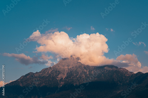 A cloud hides the peak of the mountain "Monte Legnone" on the italian Alps near Lake Como