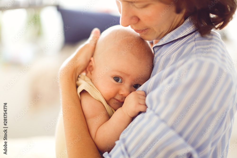 mom touches baby, mother holding child, embrace mom touches baby, mother holding child, embrace