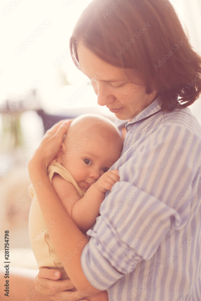 mom touches baby, mother holding child, embrace mom touches baby, mother holding child, embrace
