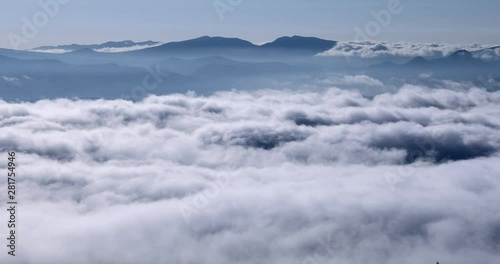 Mountains rising above fog, Koshimizu, Hokkaido, Japan photo