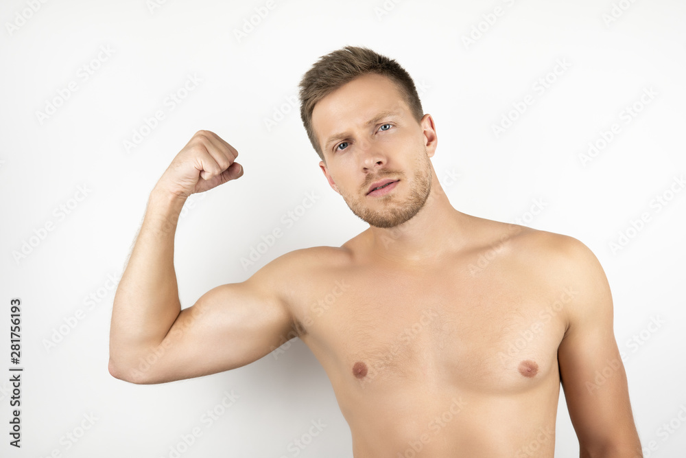 image of handsome fit man with naked torso showing pumped biceps muscles white isolated background image of handsome fit man with naked torso showing pumped biceps muscles white isolated background