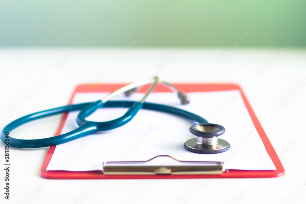 Medical stethoscope lying on cardiogram chart closeup. Medical help, prophylaxis, disease prevention or insurance concept. Cardiology care,health, protection and prevention. Healthy life concept Medical stethoscope lying on cardiogram chart closeup. Medical help, prophylaxis, disease prevention or insurance concept. Cardiology care,health, protection and prevention. Healthy life concept