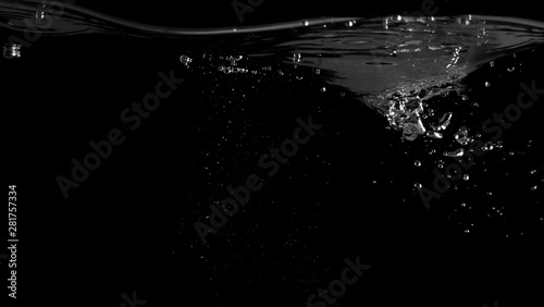 Water bubbles floating after splash underwater and black background which represent freshness of carbonate drink such as cola or soda and refreshing feeling of food product and texture.