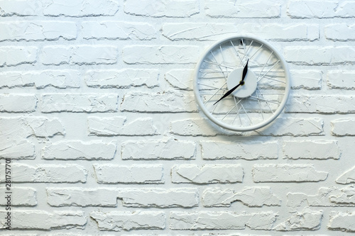 Clock in white brick wall. Background. Texture. Brick.