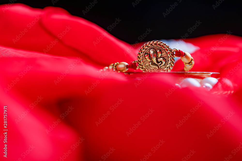 Raksha bandhan rakhi on red background Raksha bandhan rakhi on red background