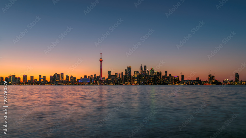 Toronto city skyline with CN Tower at sunset in Toronto, Ontario, Canada.