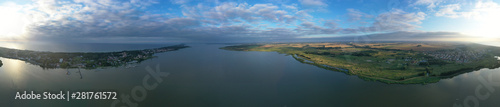 Drone Aerial 360 Degree Wide Panoramic View on Touristic City Located on Spit between Sea and Lake
