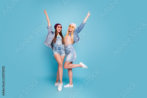 Full length body size view of nice attractive lovely fascinating cool glamorous cheerful cheery ecstatic girls having fun showing v-sign isolated over bright vivid shine blue green turquoise