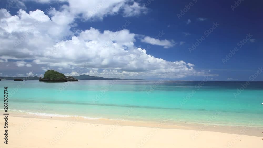 Deckchairs and umbrella on beach, Nago, Okinawa Prefecture, Japan Deckchairs and umbrella on beach, Nago, Okinawa Prefecture, Japan