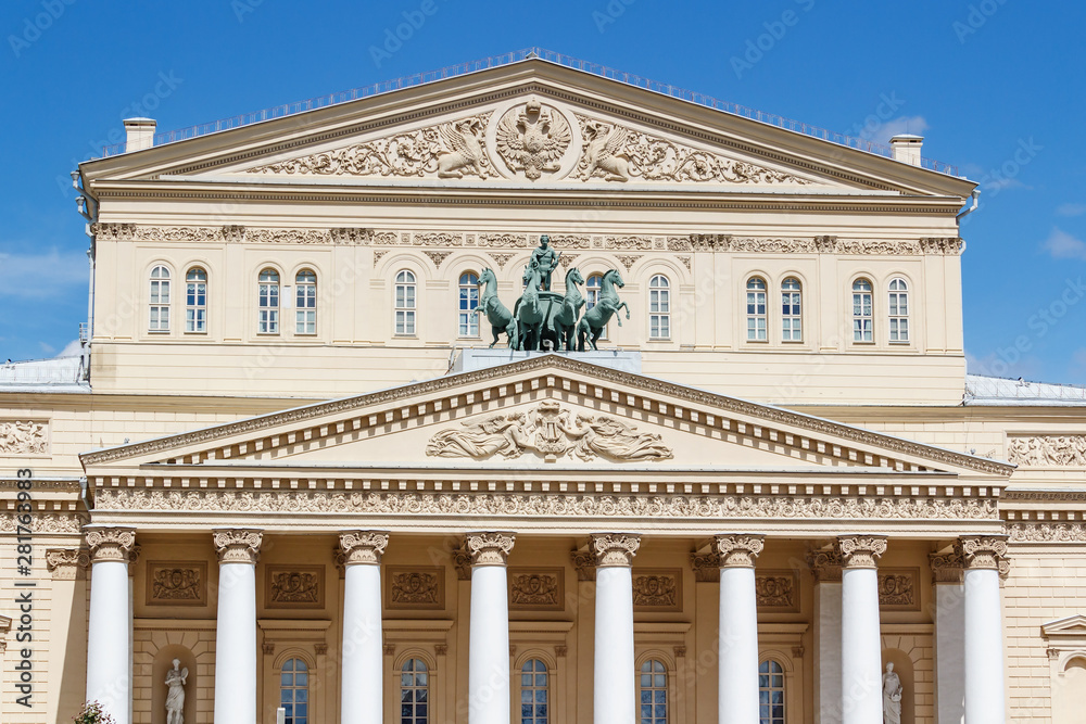 Facade of Bolshoi Theatre in Moscow closeup at sunny day against blue sky