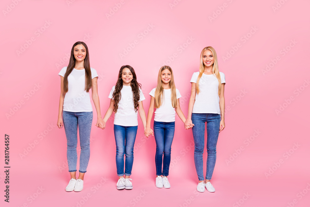 Full body photo of two small and two students ladies holding arms wear casual outfit isolated pink background Full body photo of two small and two students ladies holding arms wear casual outfit isolated pink background