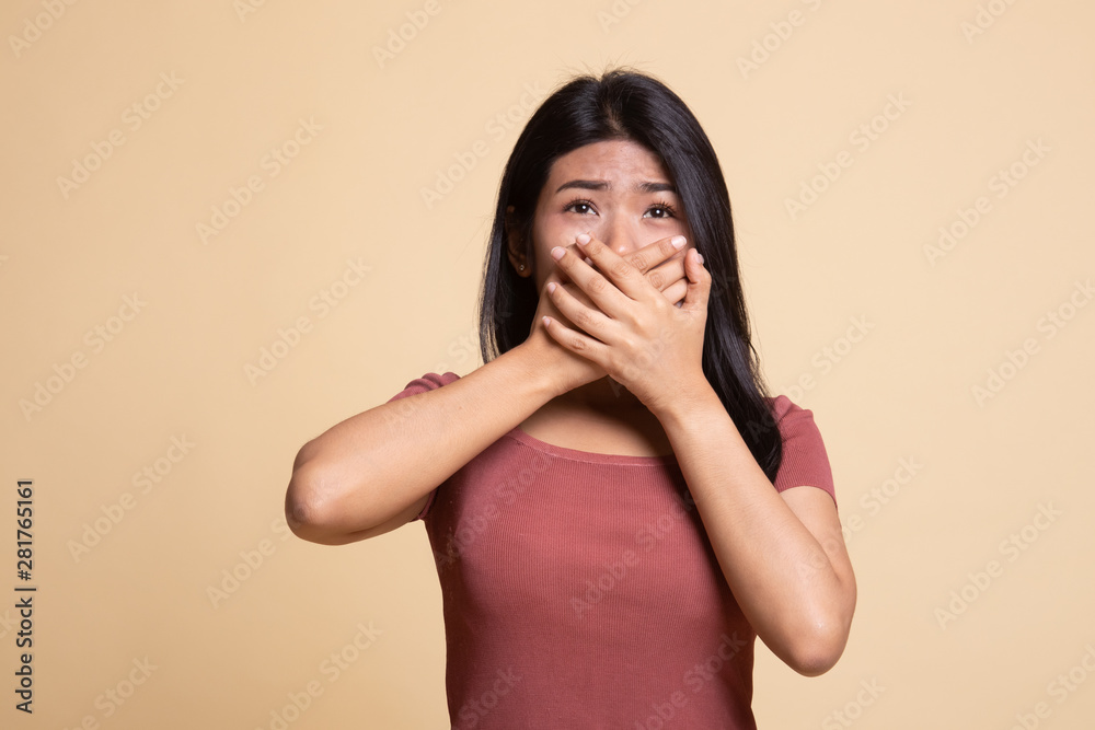 Beautiful young Asian woman close her mouth. Beautiful young Asian woman close her mouth.