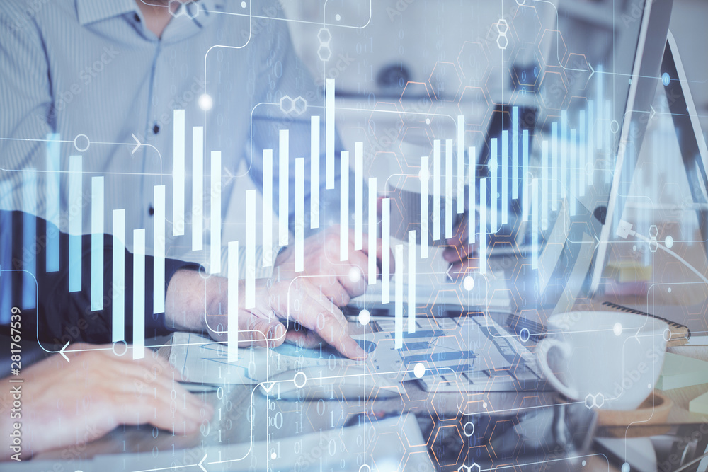 Multi exposure of chart with man typing on computer in office on background. Concept of hard work. Multi exposure of chart with man typing on computer in office on background. Concept of hard work.