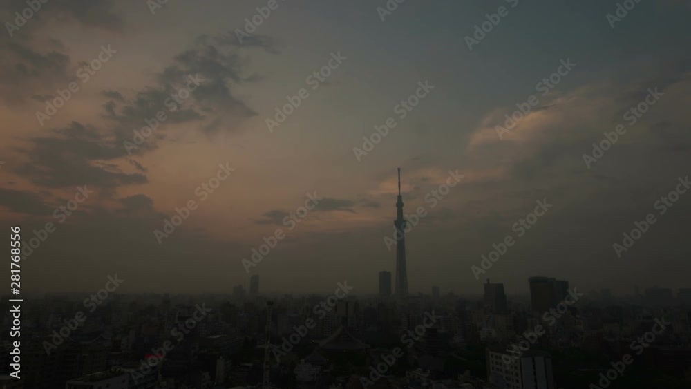 Timelapse of clouds flowing over Tokyo cityscape at sunrise, Japan Timelapse of clouds flowing over Tokyo cityscape at sunrise, Japan