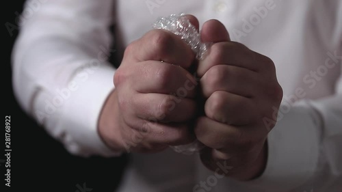 Wallpaper Mural Male hands popping the bubbles in bubble wrap to relieve stress. Soothing therapy for nervousness or just for fun. Torontodigital.ca