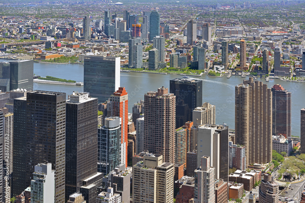 Manhattan's famous skyscrapers and Long Island, densely populated island off East Coast of United States Manhattan's famous skyscrapers and Long Island, densely populated island off East Coast of United States