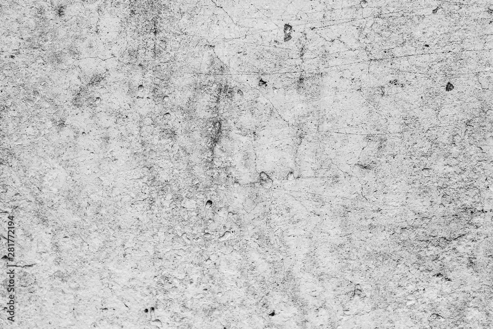 Texture of a concrete wall with cracks and scratches which can be used as a background Texture of a concrete wall with cracks and scratches which can be used as a background