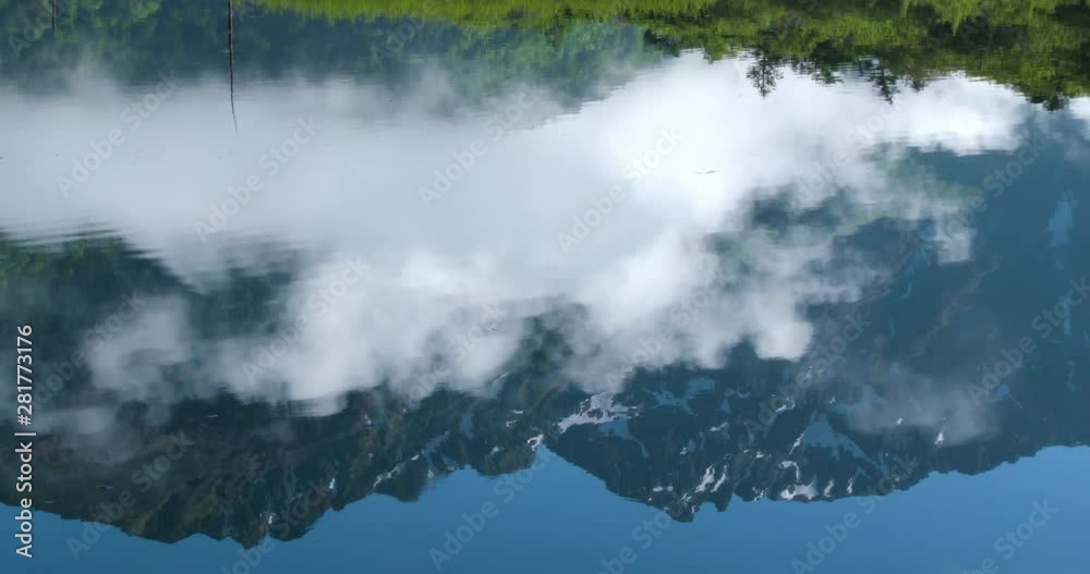 Mountain reflecting in water