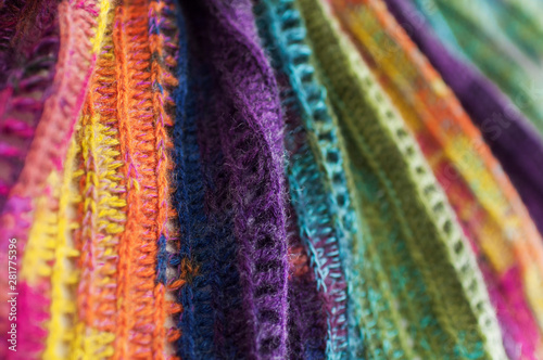 Women's hobby. Bright crochet colorful scarf. Knitting and crocheting . Texture. Background