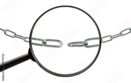 Broken metal chain under a magnifying glass isolated on a white background. Closeup. The concept of finding weak links, problems, conflicts, or solutions.