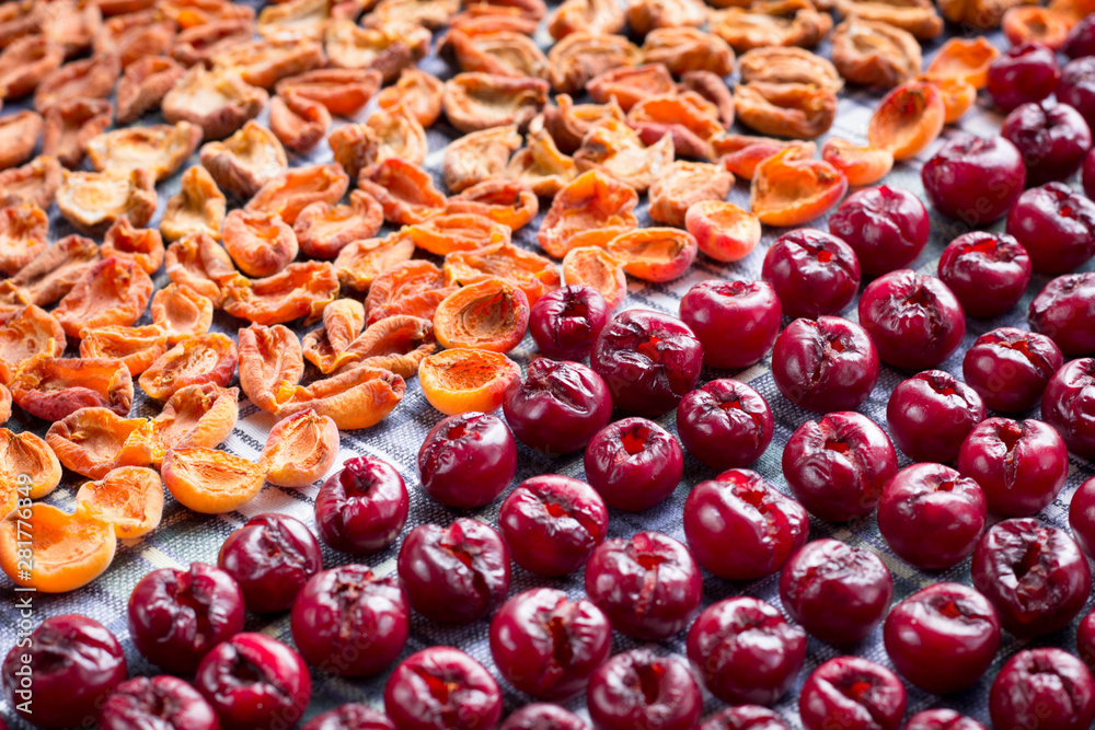 Background of fresh mellow cherries and apricots prepared for cooking Background of fresh mellow cherries and apricots prepared for cooking