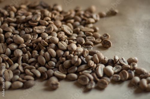 Unroasted Coffee Beans On Kraft Paper Background