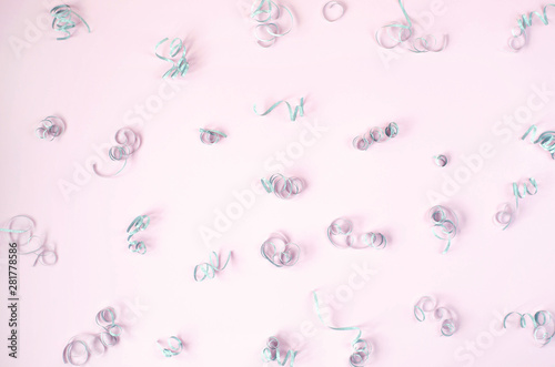 Festive pink background with silver spirals.