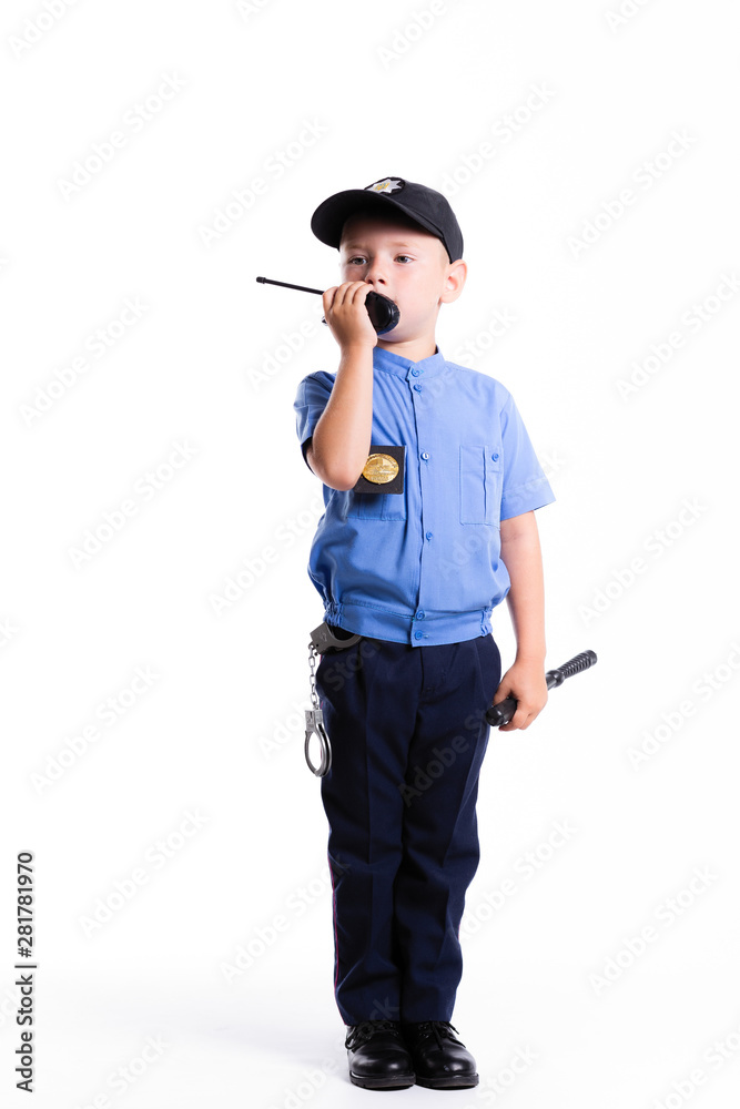 Cute little police boy with smile on face and baton on white background ...