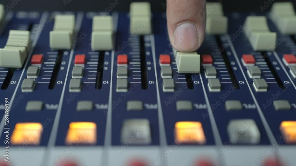Man adjusting aound an Audio mixer, Working with sound mixing console. Man adjusting aound an Audio mixer, Working with sound mixing console.