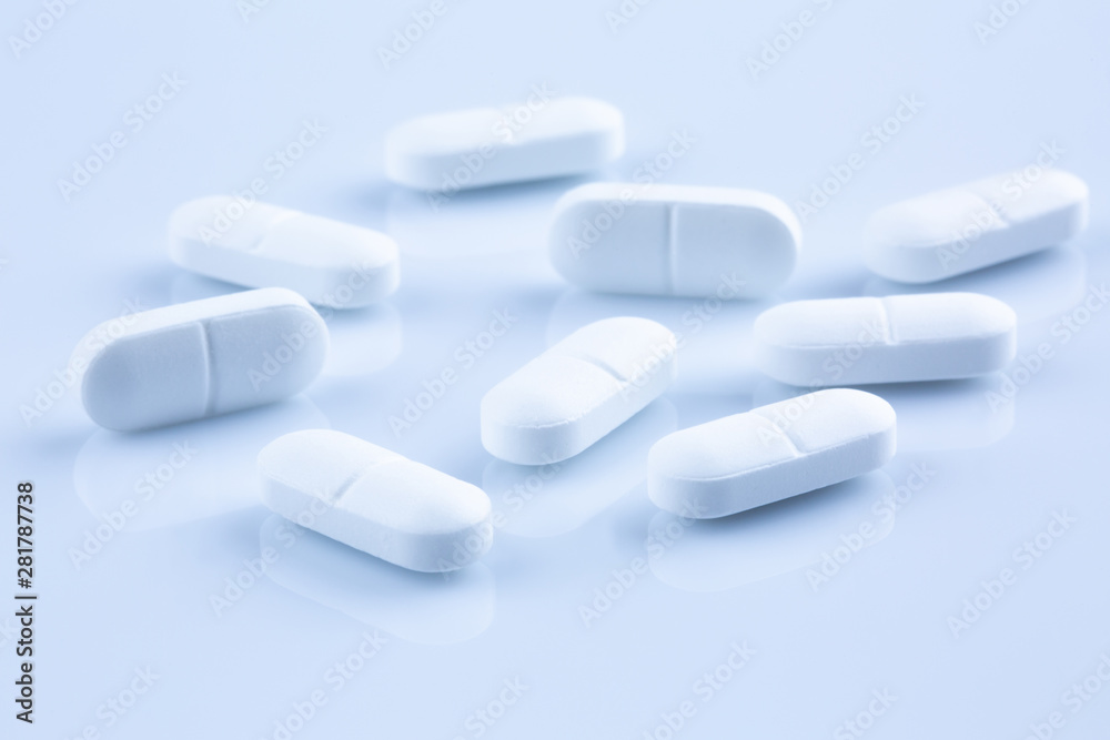 Closeup of white antibiotic pills. Closeup of white antibiotic pills.